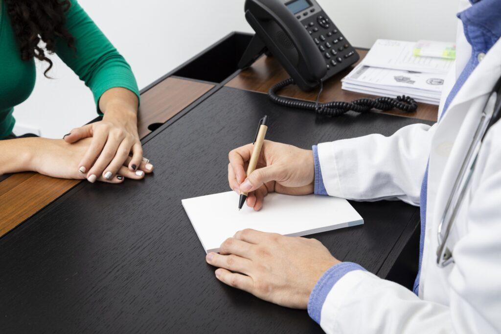 close up doctor writing prescription